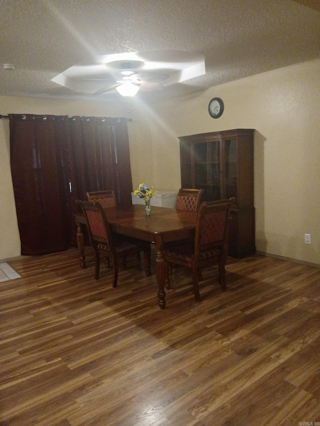 320 S Lewis St, Mineral Sprs, AR 71851 - dining room with a ceiling fan, wood finished floors, and a textured ceiling