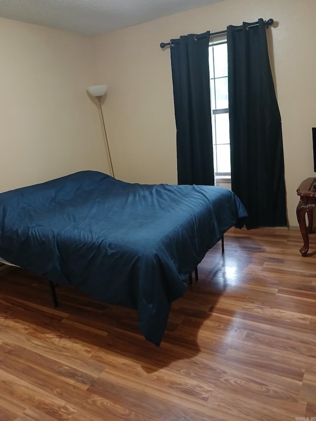 320 S Lewis St, Mineral Sprs, AR 71851 - bedroom featuring wood finished floors