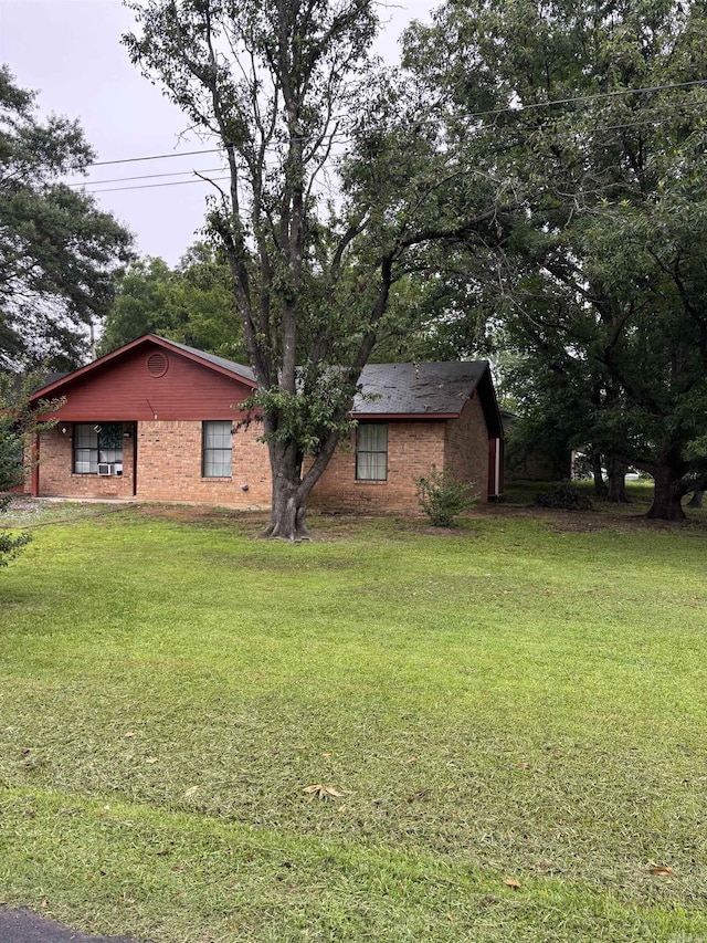 320 S Lewis St, Mineral Sprs, AR 71851 - view of property exterior featuring a lawn