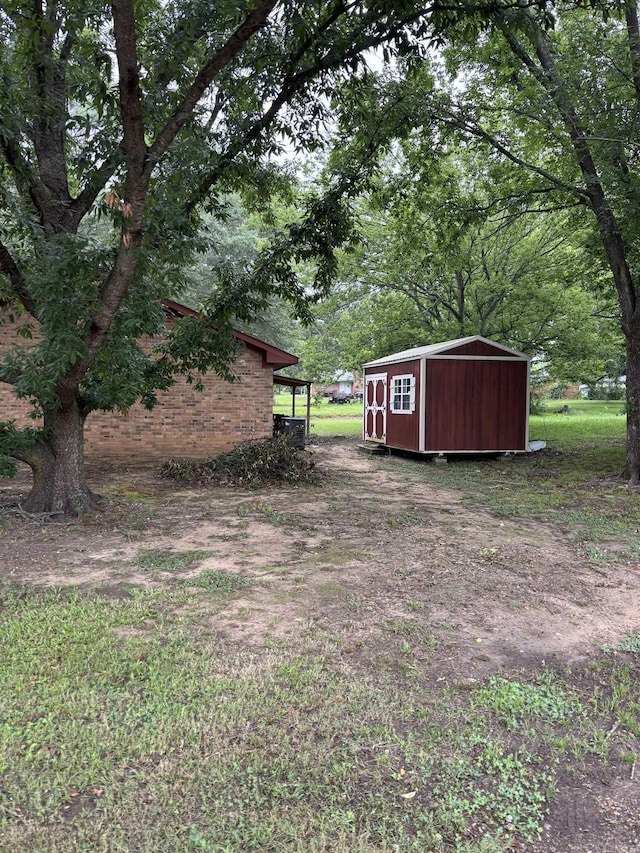 320 S Lewis St, Mineral Sprs, AR 71851 - view of yard with a shed