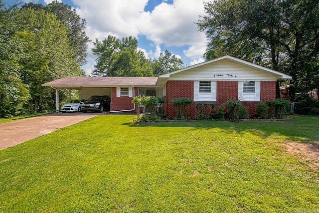 1920 W Arch Ave, Searcy, AR 72143 - view of front of house with brick siding, concrete driveway, a carport, and a front lawn