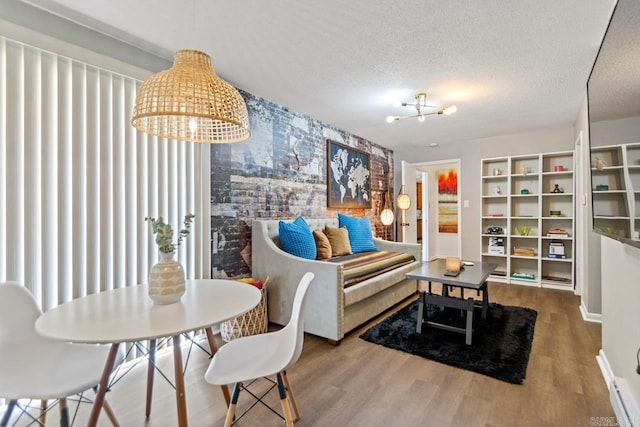 1920 W Arch Ave, Searcy, AR 72143 - living area featuring a chandelier, wood finished floors, and a textured ceiling