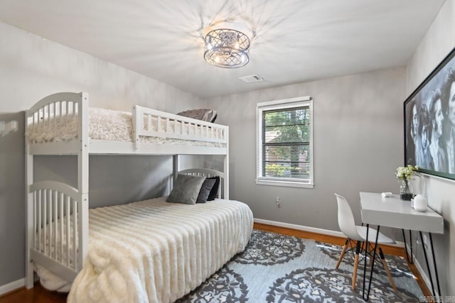 1920 W Arch Ave, Searcy, AR 72143 - bedroom with baseboards and wood finished floors