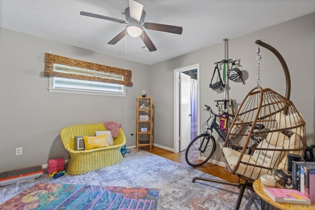 1920 W Arch Ave, Searcy, AR 72143 - rec room with healthy amount of natural light, a ceiling fan, and wood finished floors