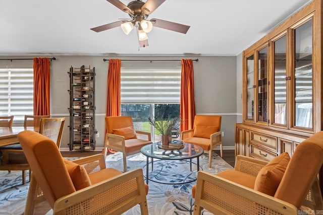 1920 W Arch Ave, Searcy, AR 72143 - sitting room featuring ceiling fan, wood finished floors, and ornamental molding
