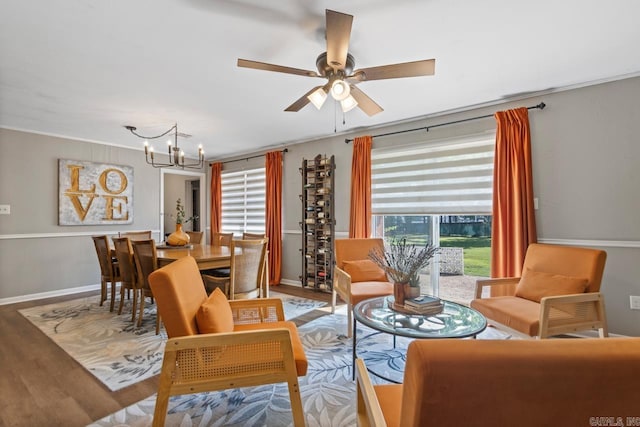 1920 W Arch Ave, Searcy, AR 72143 - living room with a chandelier, ceiling fan, wood finished floors, and ornamental molding