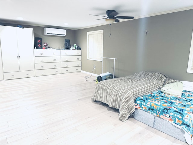 bedroom with a wall mounted air conditioner, crown molding, light wood-style flooring, and a ceiling fan
