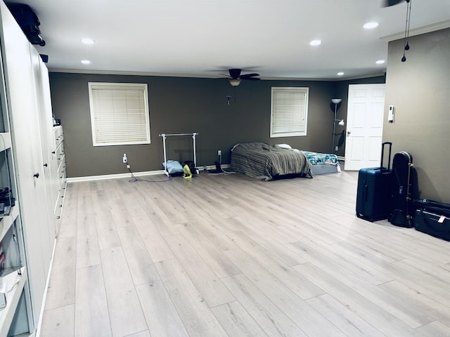 unfurnished bedroom featuring light wood-style flooring, recessed lighting, ceiling fan, and crown molding
