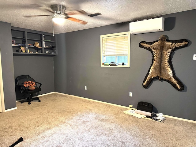 unfurnished bedroom with a wall unit AC, carpet flooring, a textured ceiling, and ceiling fan