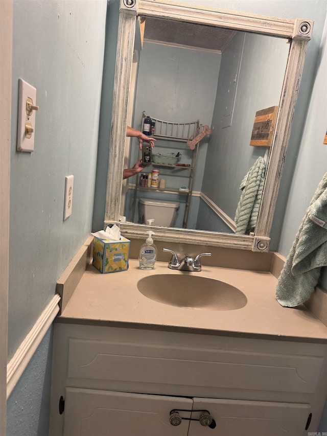 half bath with vanity and toilet