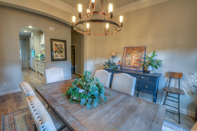 152 Callaway Cir, Hot Springs, AR 71913 - dining room with arched walkways, ornamental molding, wood finished floors, and a chandelier