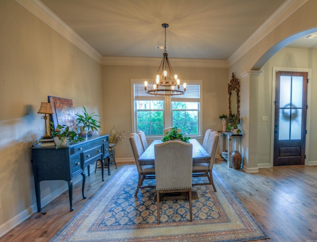 152 Callaway Cir, Hot Springs, AR 71913 - dining room with arched walkways, a chandelier, wood finished floors, and crown molding