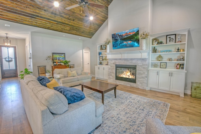152 Callaway Cir, Hot Springs, AR 71913 - living room featuring high vaulted ceiling, arched walkways, hardwood / wood-style floors, a ceiling fan, and a fireplace
