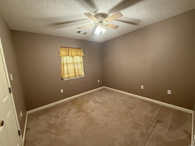 1008 Fox Ridge Dr, Benton, AR 72019 - empty room featuring a ceiling fan, carpet, and a textured ceiling