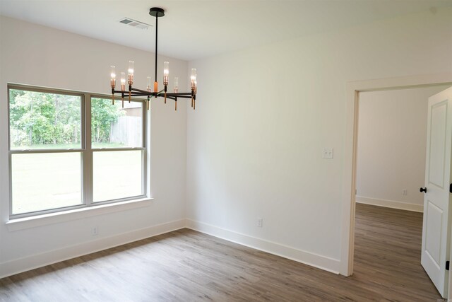 4013 Springwood Cir, Bryant, AR 72022 - unfurnished room with a chandelier and wood finished floors