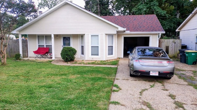 single story home with driveway, covered porch, a garage, and a shingled roof