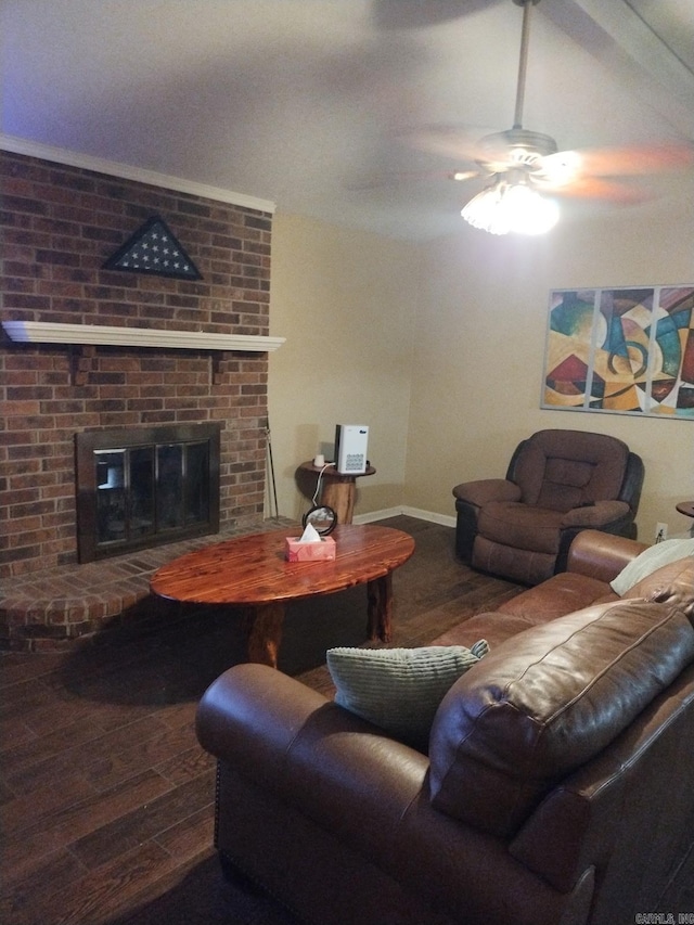 living room featuring wood finished floors, a fireplace, and ceiling fan