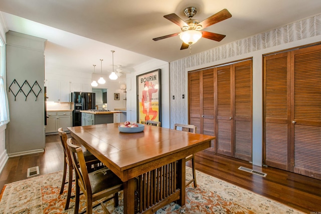 319 W G Ave, North Little Rock, AR 72116 - dining room featuring dark wood-style flooring and ceiling fan