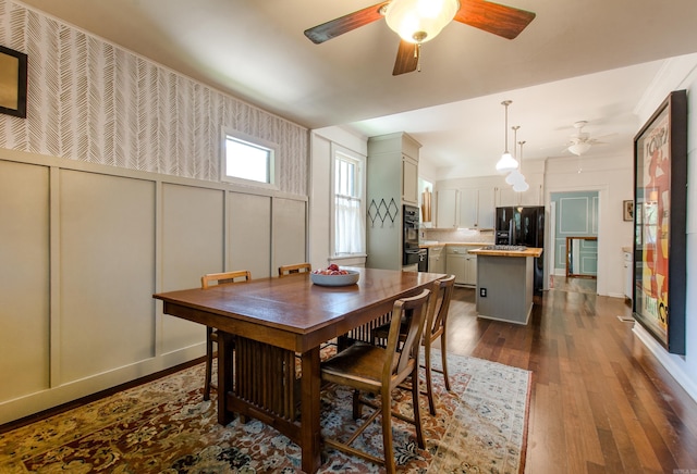 319 W G Ave, North Little Rock, AR 72116 - dining space with a ceiling fan and dark wood-style floors