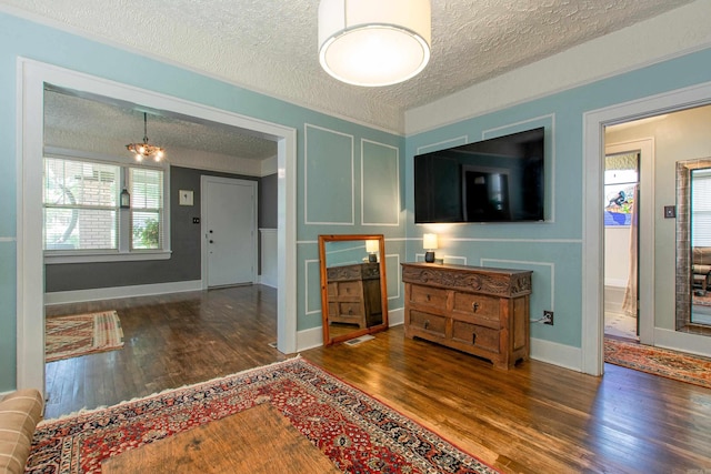 319 W G Ave, North Little Rock, AR 72116 - living area with a textured ceiling and wood finished floors
