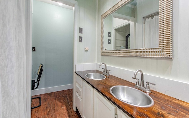319 W G Ave, North Little Rock, AR 72116 - full bathroom with double vanity and wood finished floors