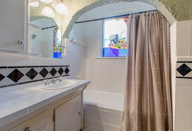 319 W G Ave, North Little Rock, AR 72116 - full bathroom featuring vanity, backsplash, and shower / tub combo with curtain