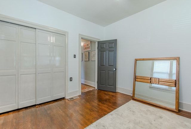 319 W G Ave, North Little Rock, AR 72116 - unfurnished bedroom with wood finished floors and a closet
