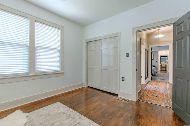319 W G Ave, North Little Rock, AR 72116 - unfurnished bedroom featuring wood finished floors and a closet
