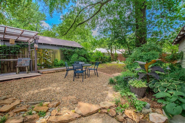 319 W G Ave, North Little Rock, AR 72116 - fenced backyard featuring outdoor dining area