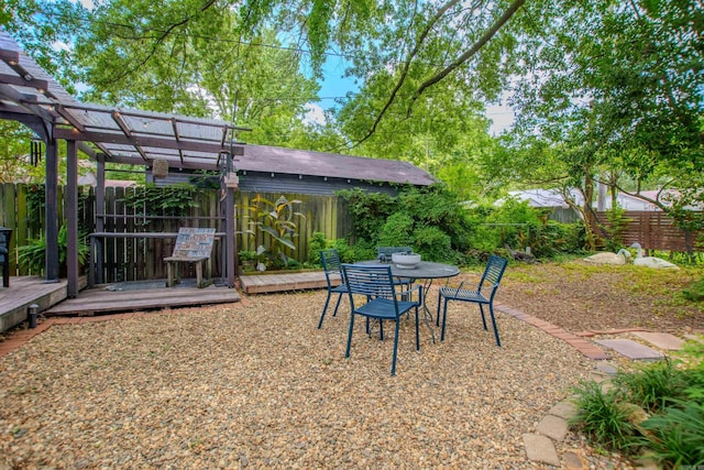 319 W G Ave, North Little Rock, AR 72116 - fenced backyard with a pergola and a deck