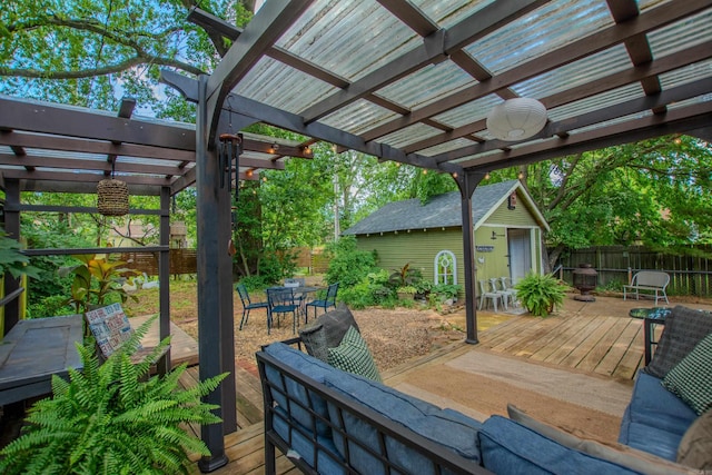 319 W G Ave, North Little Rock, AR 72116 - deck with a pergola, outdoor dining space, a fenced backyard, and an outbuilding
