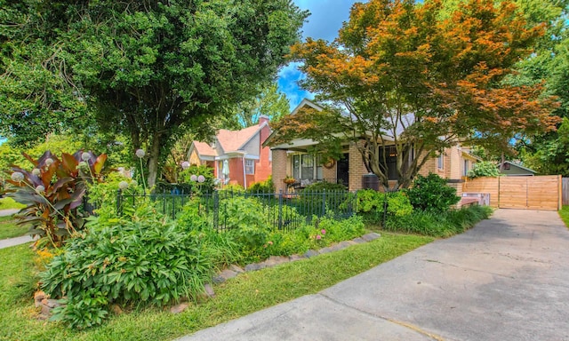 319 W G Ave, North Little Rock, AR 72116 - obstructed view of property featuring brick siding and a gate
