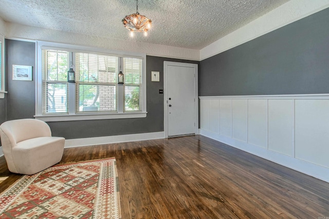 319 W G Ave, North Little Rock, AR 72116 - entryway with a textured ceiling, dark wood-style floors, and wainscoting