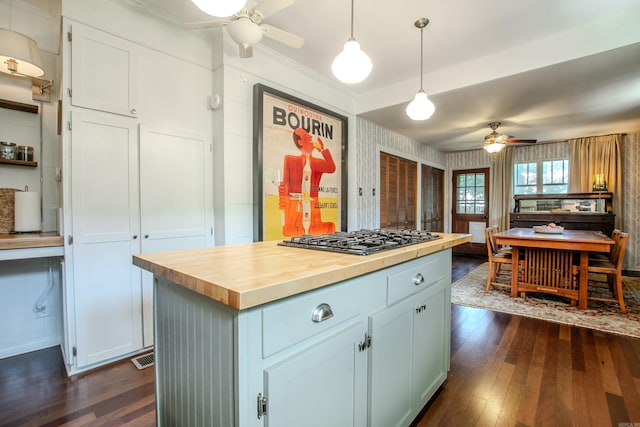 319 W G Ave, North Little Rock, AR 72116 - kitchen featuring a ceiling fan, gas stovetop, wooden counters, dark wood-type flooring, and wallpapered walls