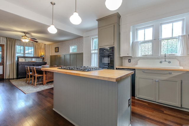 319 W G Ave, North Little Rock, AR 72116 - kitchen featuring butcher block counters, oven, gray cabinetry, and stainless steel gas cooktop