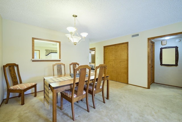 109 Indian Hills St Unit C-5, Hot Springs, AR 71913 - dining space featuring light carpet, a chandelier, and a textured ceiling