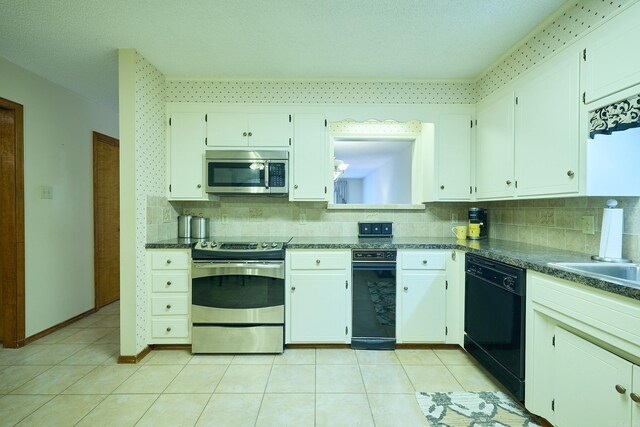 109 Indian Hills St Unit C-5, Hot Springs, AR 71913 - kitchen with stainless steel appliances, tasteful backsplash, white cabinetry, and light tile patterned floors