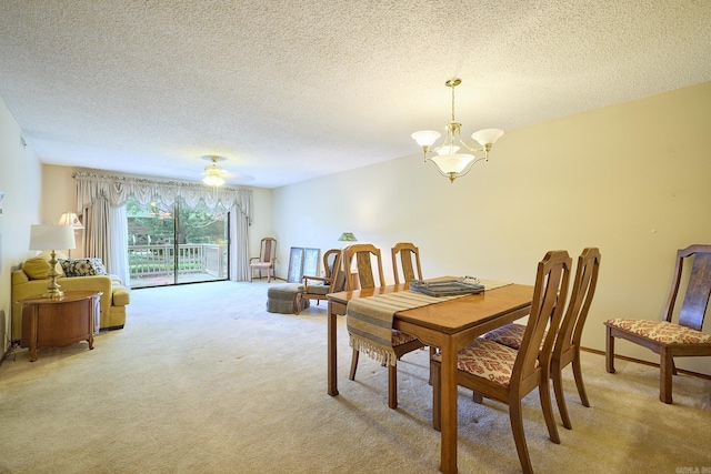 109 Indian Hills St Unit C-5, Hot Springs, AR 71913 - dining space with light colored carpet, a textured ceiling, a chandelier, and a ceiling fan