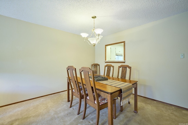 109 Indian Hills St Unit C-5, Hot Springs, AR 71913 - dining space featuring a chandelier, light colored carpet, and a textured ceiling