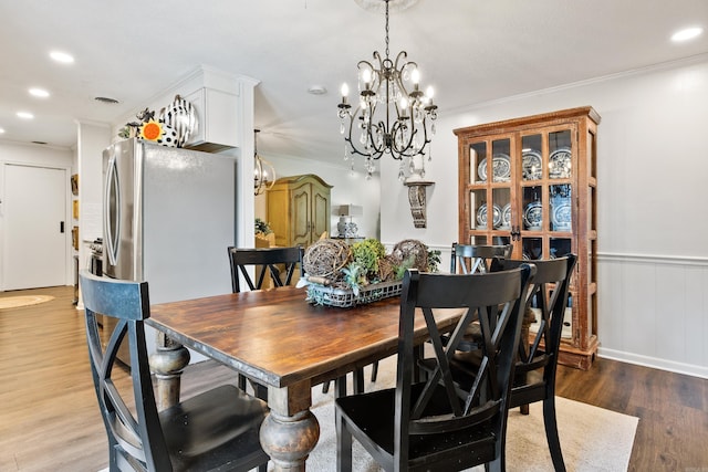 520 E 8th St, Lonoke, AR 72086 - dining room featuring a chandelier, light wood-style floors, crown molding, and recessed lighting