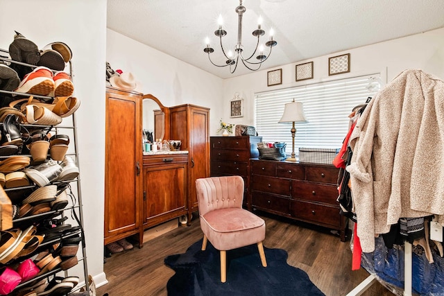 520 E 8th St, Lonoke, AR 72086 - living area with dark wood-style flooring and a chandelier