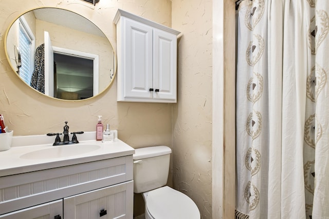 520 E 8th St, Lonoke, AR 72086 - bathroom featuring a textured wall, vanity, and curtained shower