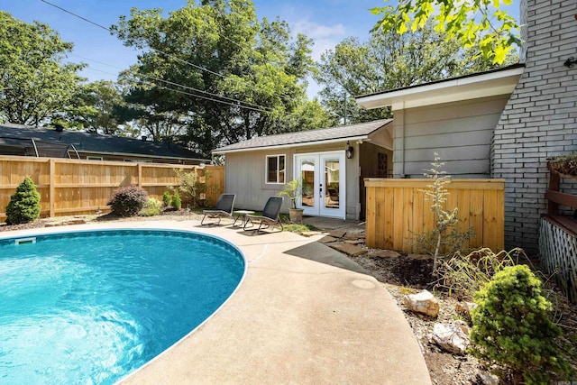 520 E 8th St, Lonoke, AR 72086 - view of swimming pool with french doors and a patio