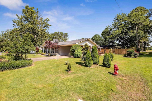 520 E 8th St, Lonoke, AR 72086 - view of front of house featuring concrete driveway and an attached carport