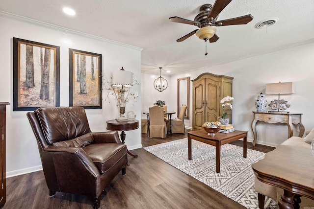 520 E 8th St, Lonoke, AR 72086 - living area with a ceiling fan, crown molding, wood finished floors, a textured ceiling, and a chandelier
