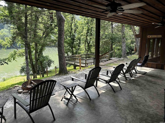 410 S Riverview Ln, Mountain View, AR 72560 - view of patio with ceiling fan, a fire pit, and a wooden deck