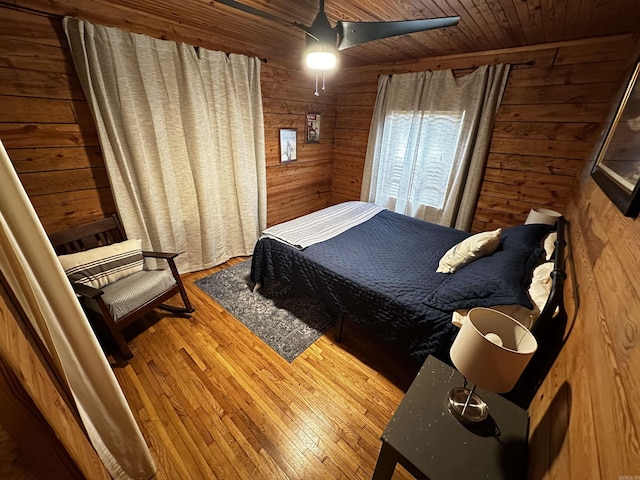 410 S Riverview Ln, Mountain View, AR 72560 - bedroom with wooden walls, hardwood / wood-style flooring, wooden ceiling, and ceiling fan