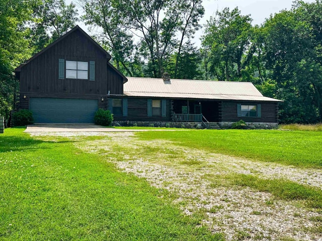 410 S Riverview Ln, Mountain View, AR 72560 - view of front of home featuring a garage, driveway, a front yard, and a metal roof