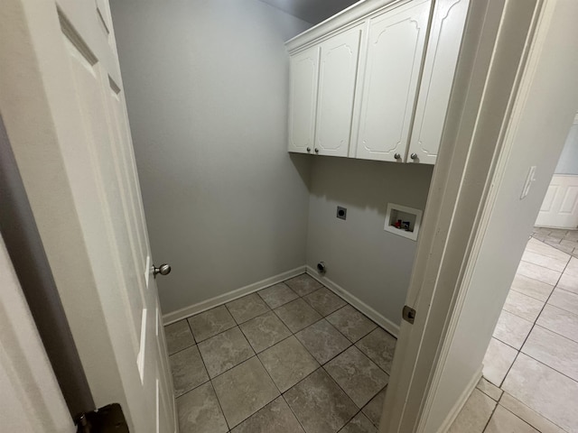 1010 Tori Ln, Beebe, AR 72012 - laundry area with electric dryer hookup, washer hookup, cabinet space, and light tile patterned floors