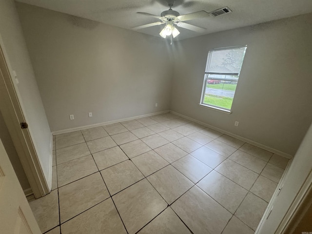 1010 Tori Ln, Beebe, AR 72012 - empty room with a ceiling fan and light tile patterned flooring